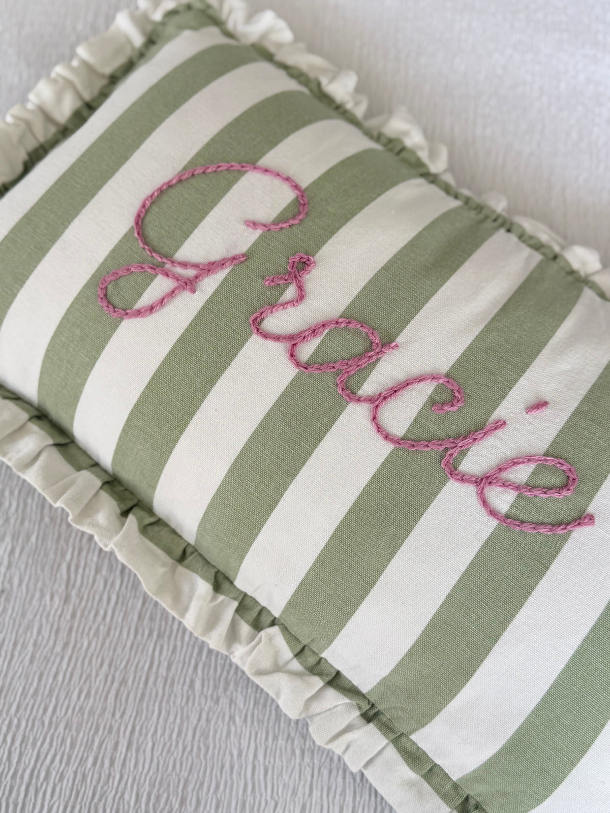 Green ruffle stripe cushions