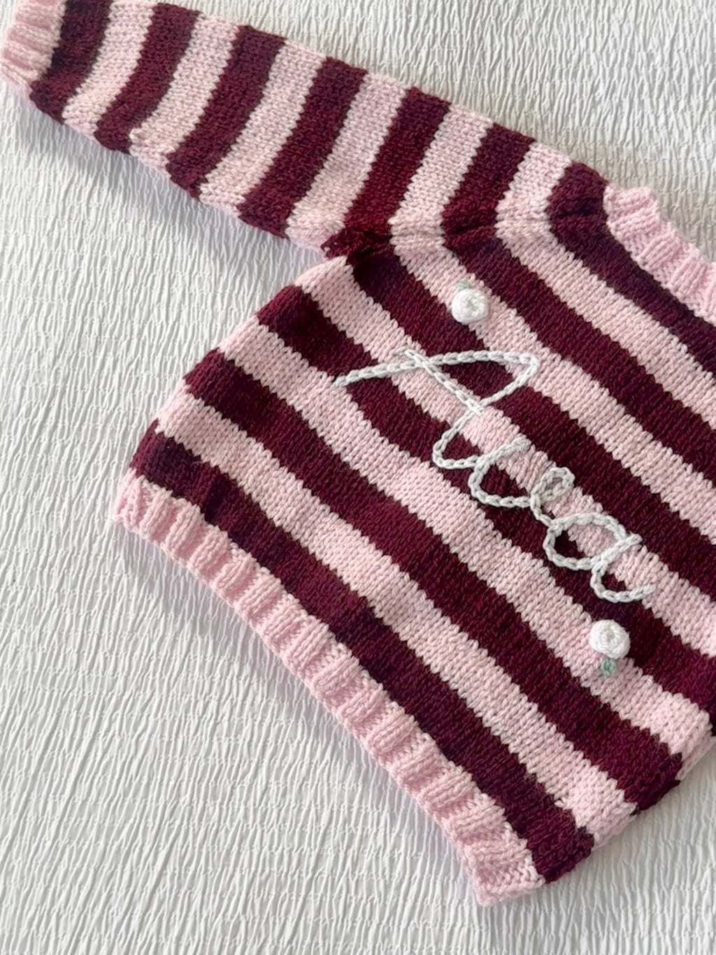 Pink and burgundy stripe hand-knit
