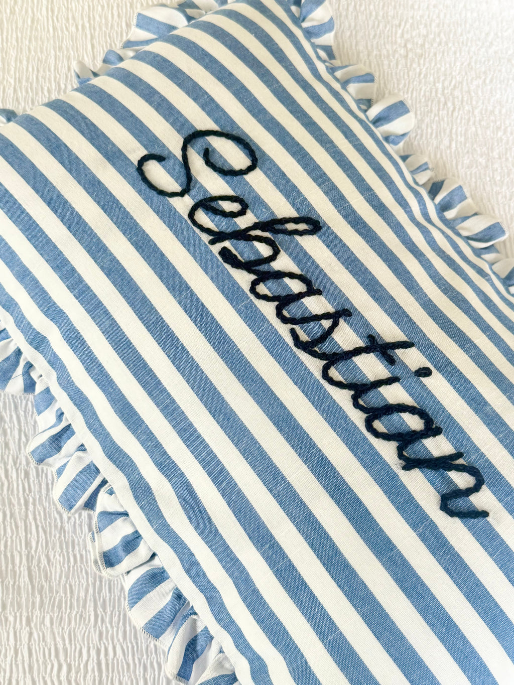 Blue and white ruffle cushion
