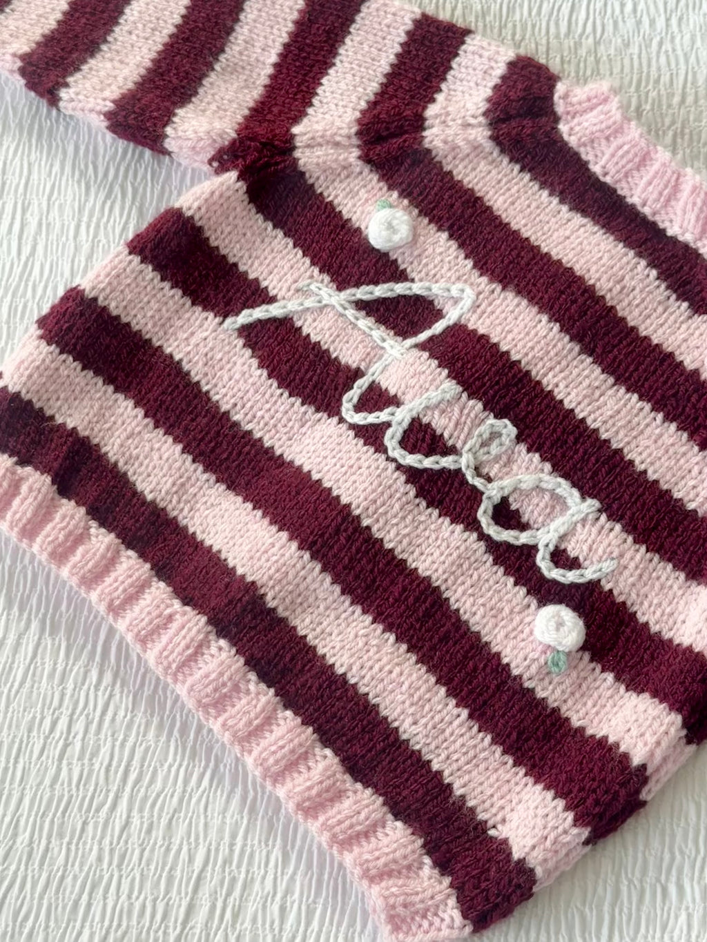 Pink and burgundy stripe hand-knit