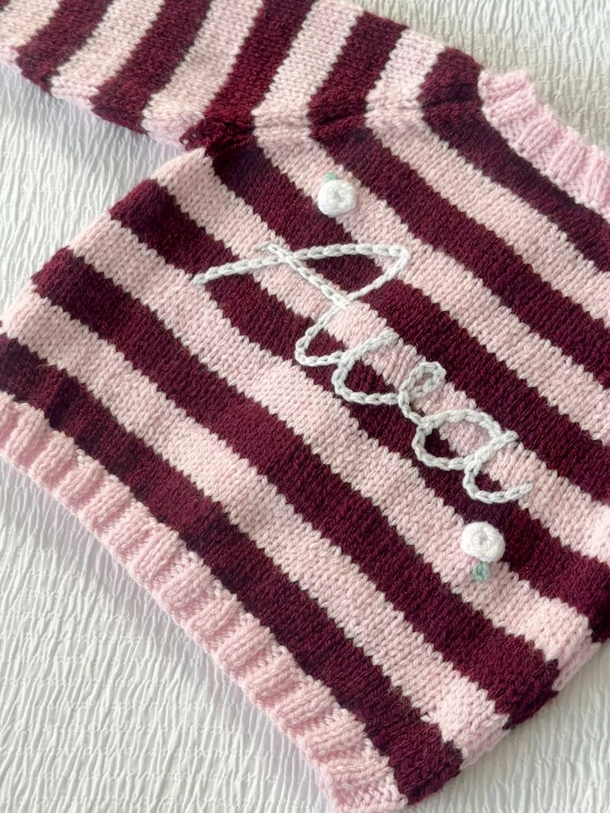 Pink and burgundy stripe hand-knit