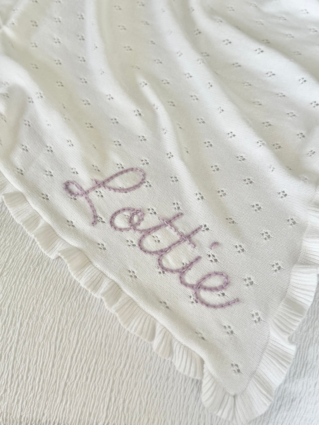 White ruffle baby blanket