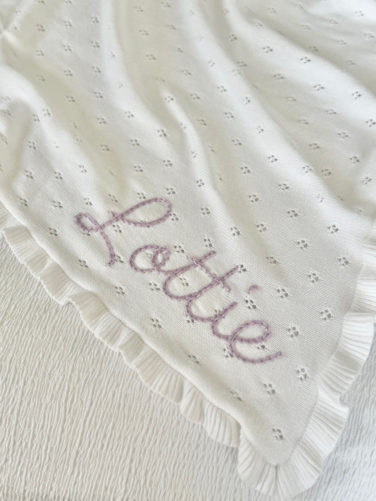 White ruffle baby blanket
